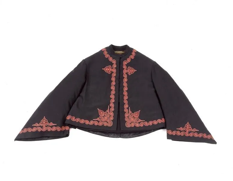 A traditional black jacket with intricate pink embroidery on the chest, collar, and sleeves, displayed against a white background.