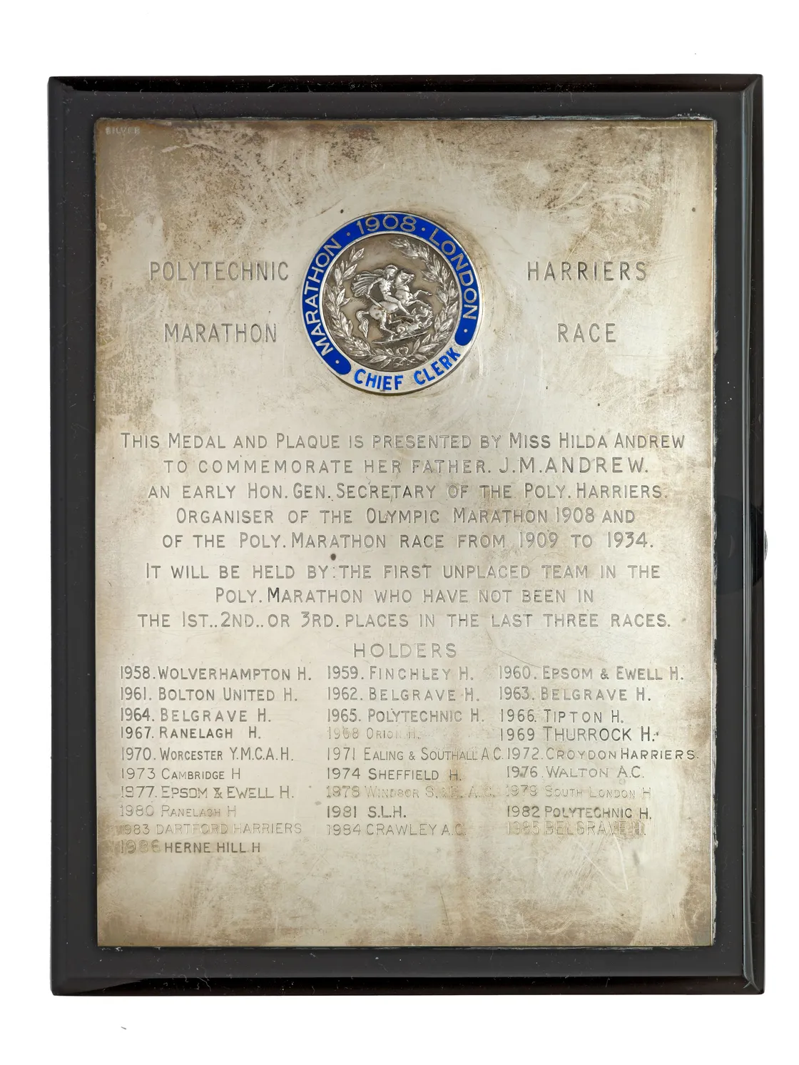 Vintage sports plaque displaying a list of medal and plaque winners from 1958 to 1984 at harrison's leonard trophy marathon and plaque events, in a glass frame.
