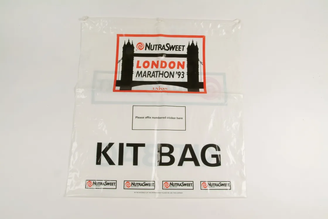 A transparent kit bag with the london marathon 1993 nutrasweet sponsorship logos, labeled prominently as "kit bag".