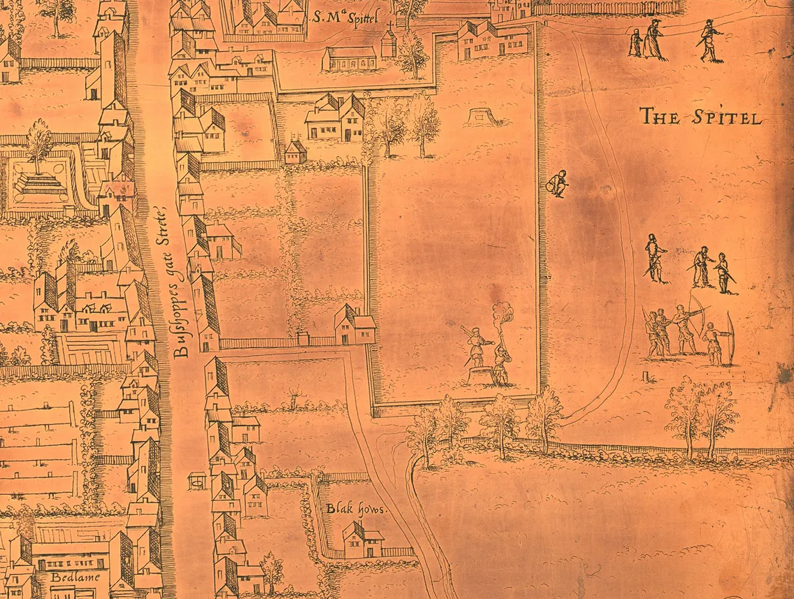 A close-up of a map on a copper plate, showing etchings of streets and buildings