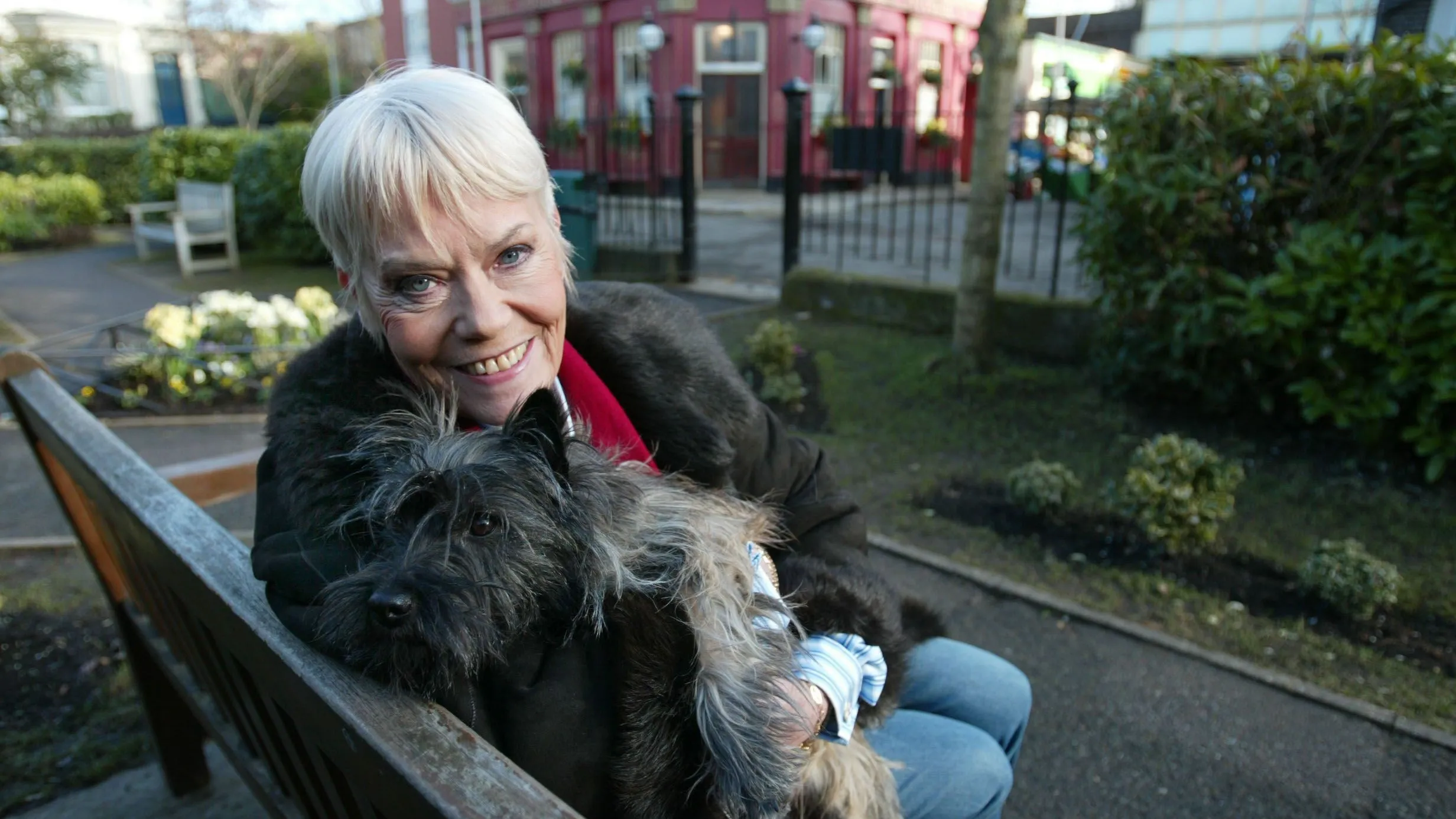 B4TMMC Wendy Richards February 2006 Eastenders 21 years on in Albert Square Soap opera actress 2000s Pictured with her dog betty The Queen Vic pub in the background Public House