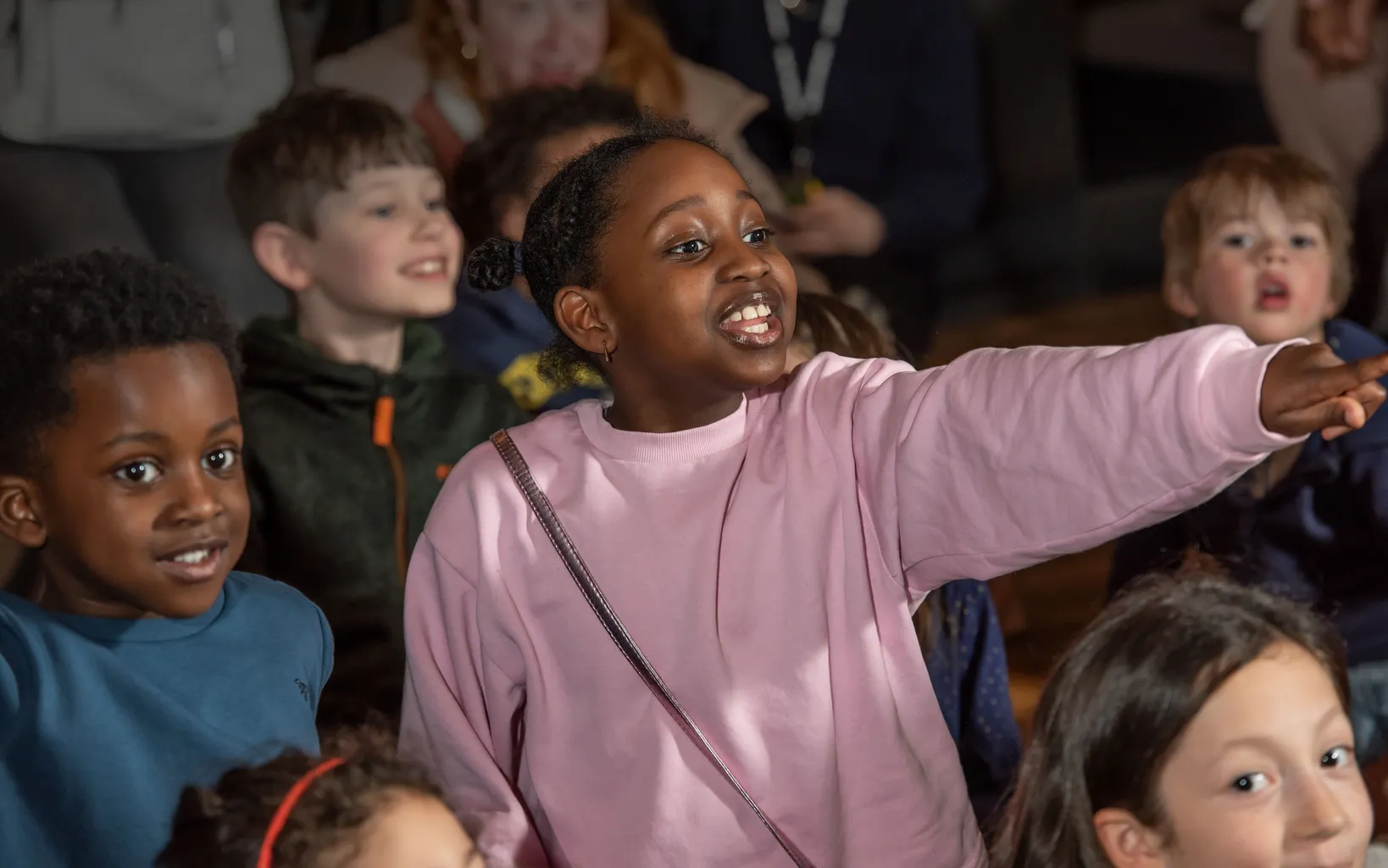 Visitors watching a theatre performance as part of Saster Family Events at Museum of London Docklands April 2023