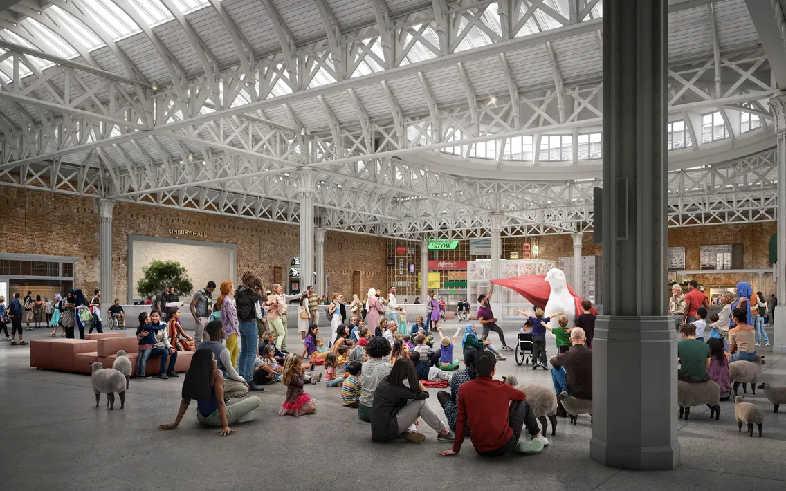 Our large indoor space with exposed steel beams and brick walls is filled with people sitting, standing, and interacting; a few art displays and a large, white sculpture create a dynamic, general atmosphere.
