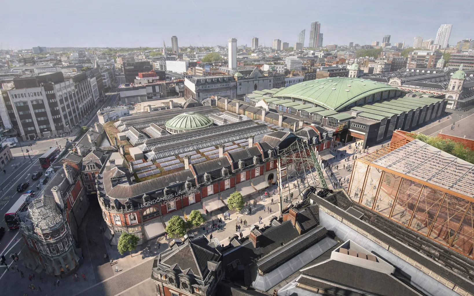 Aerial view of London Museum at Smithfield amid urban buildings and streets under a clear sky.
