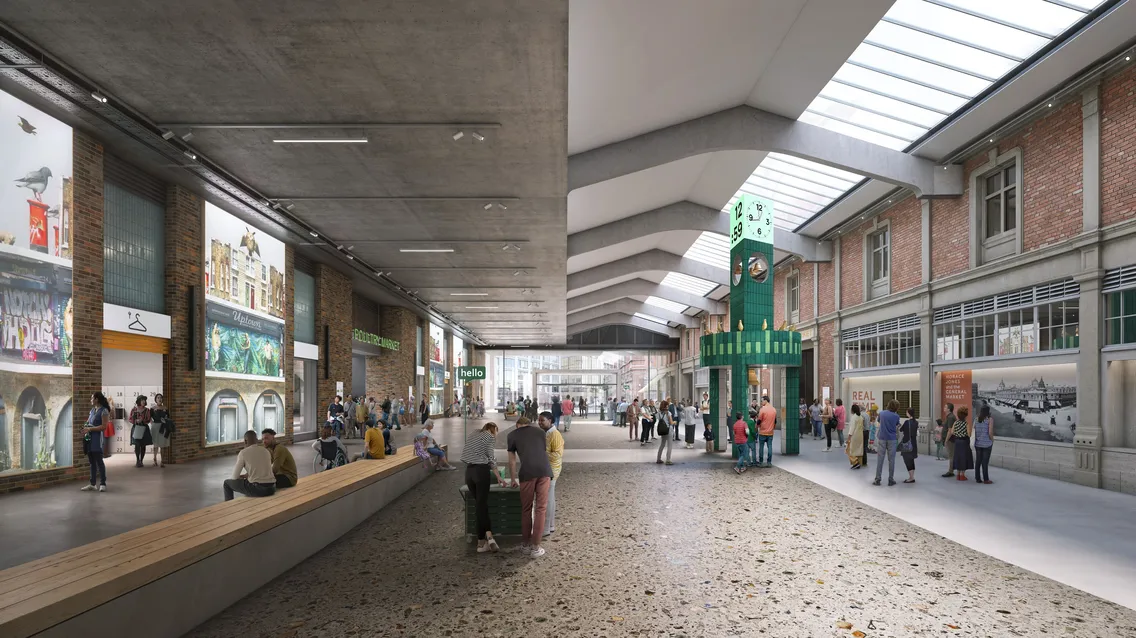 Wide indoor public space with heritage brick walls, skylights, a green clock tower marking the passage of time, people walking and sitting, and various shops and displays along the street-like sides.