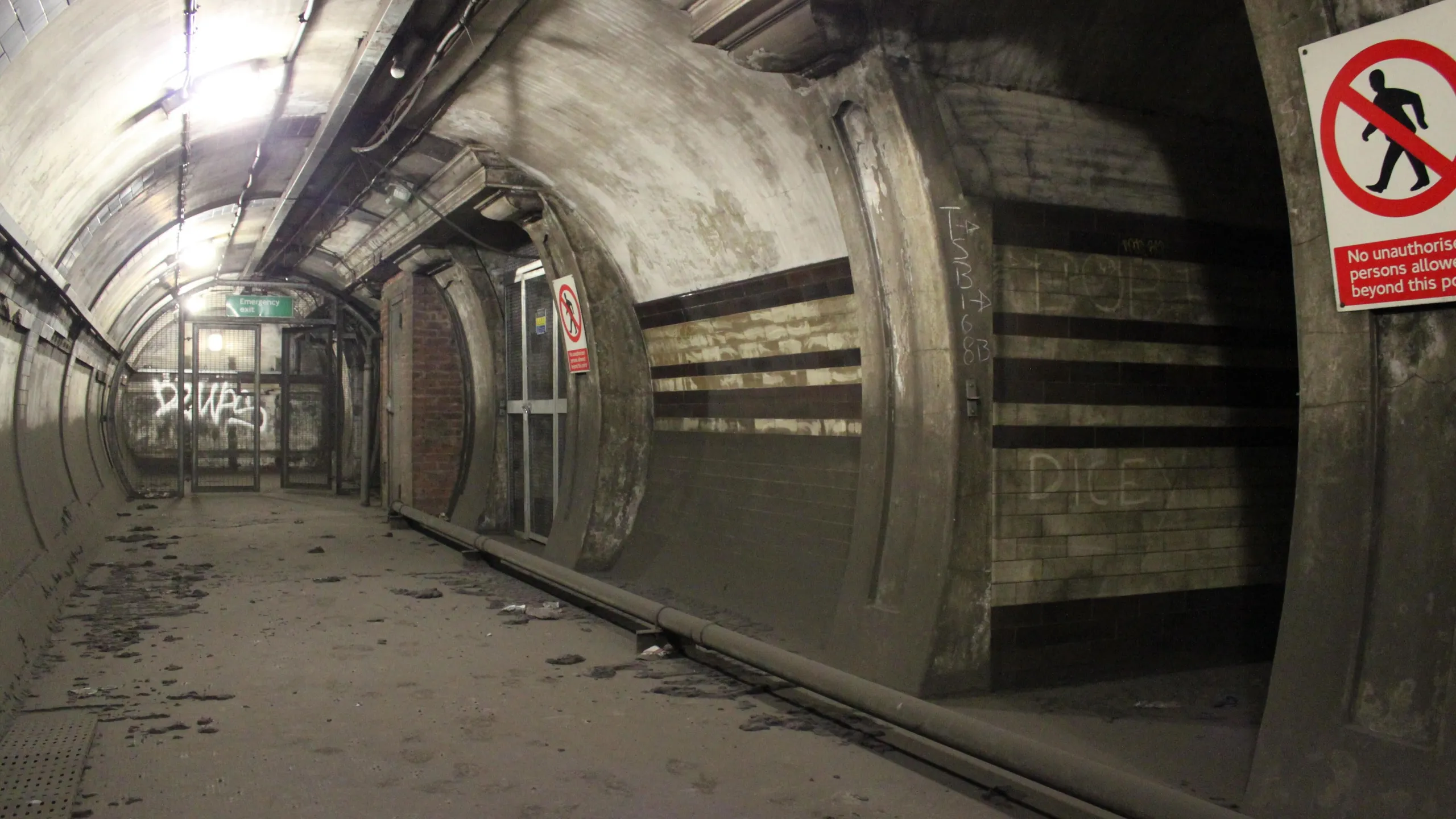 HYY87T South Kentish Town Underground station 
Former lower lift landing. HAUNTING pictures have revealed the long-forgotten abandoned London Underground stations that lie deep below the city. The eerie images show the empty dusty Aldwych Underground station, which closed in 1994 and has been used as a film set for several high-profile productions including Sherlock, MR Selfridge and V for Vendetta. Other shots show other disused platforms and bricked up entrances to the former underground station including at Euston where the entrance closed in 1914 and the graffiti-clad Shoreditch station which clo