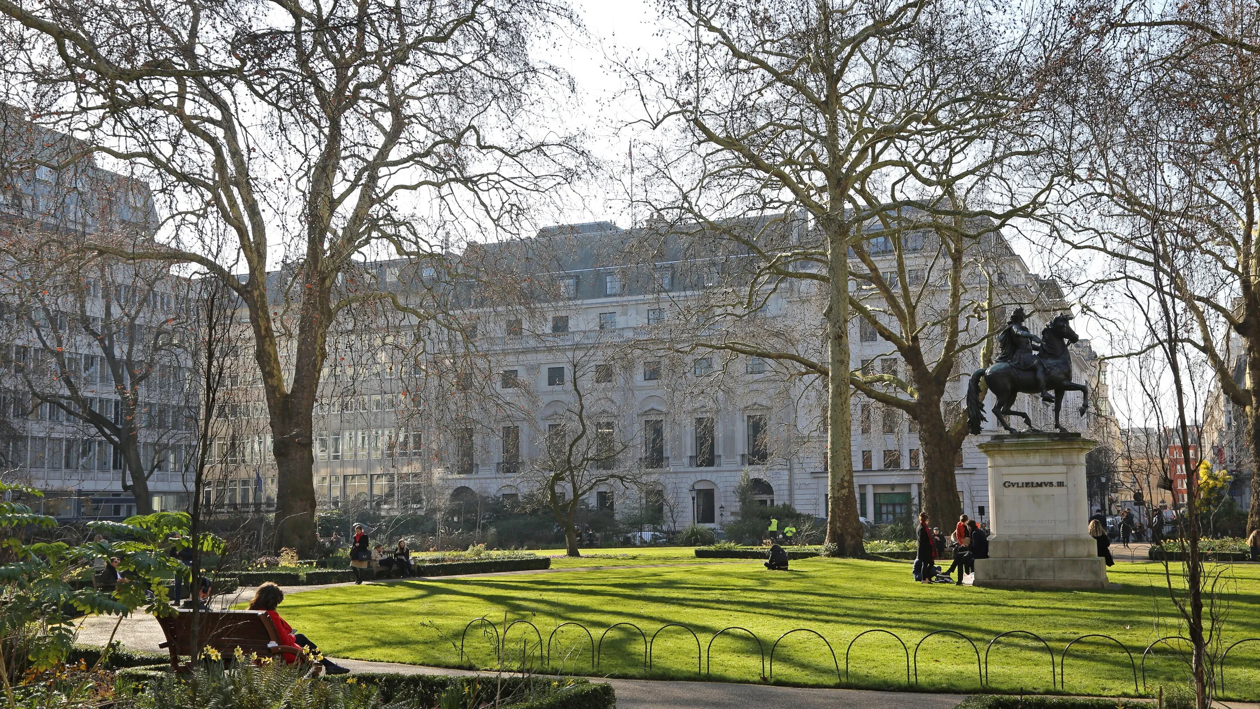 RP064W Sunny, winter day in St James's Square, London. Shows georgian buildings and William III statue.