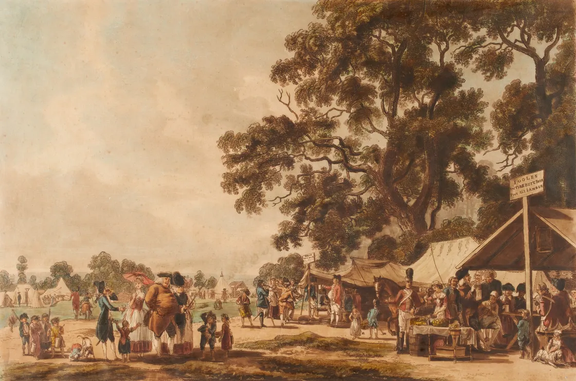 A large group of people milling around tents in an open space