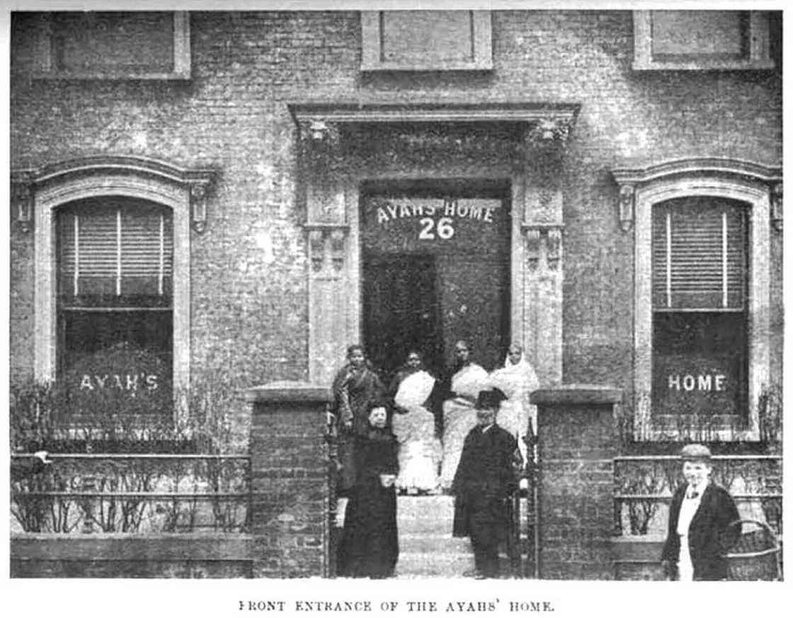A group of people in front of a house that reads 'Ayahs Home' above the door