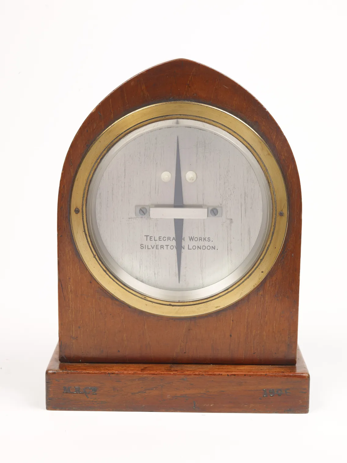 Vintage wooden telegraphometer by silverton of london, featuring a brass bezel and a clear, circular glass face showcasing two centered needle pointers.