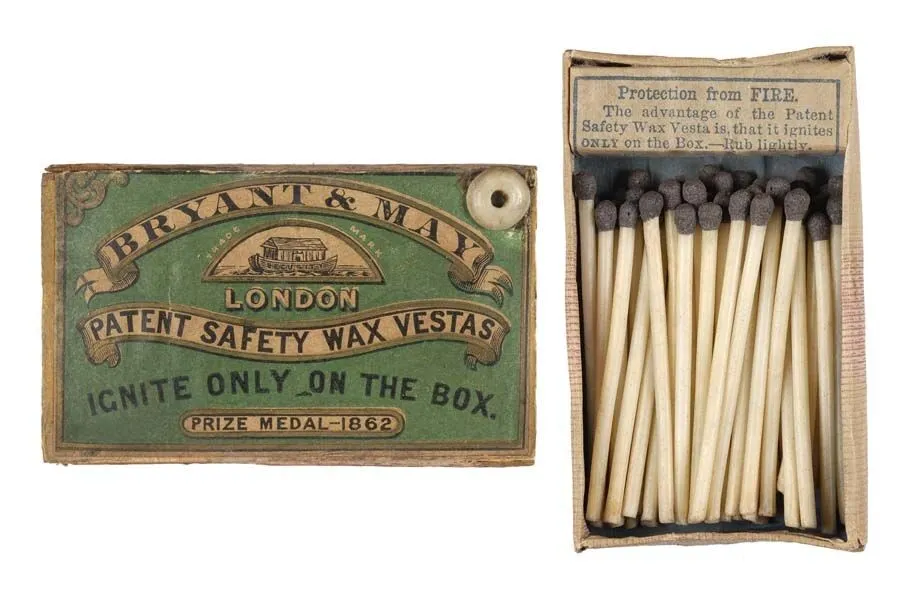 Vintage Bryant & May safety matchbox with matches, displaying instructions and a green label, isolated on a white background.